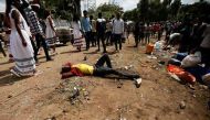 An injured protester waits for help after several people died during the Irrechaa, the thanks giving festival of the Oromo people in Bishoftu town of Oromia region, Ethiopia, October 2, 2016. REUTERS/Tiksa Negeri