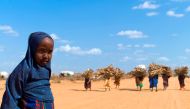 File photo of a Somali girl accompanying women bringing firewood to the Ifo refugee camp in Dadaab near the Kenya-Somali border. Photo by Eduardo De Francisco/Reuters
