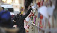 Well-wishers place flowers and cards outside a mosque after a fire in Eskilstuna, Sweden. Photograph: Pontus Stenberg/AP