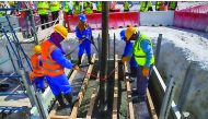 Workers at the construction site of the Al Rayyan Stadium.