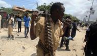 A Somali policeman walks at the scene of an explosion outside the headquarters of Somalia's Criminal Investigation Department (CID) in the capital Mogadishu, July 31, 2016. REUTERS/Ismail Taxta/File Photo.