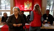 A woman prepares to vote at a polling station during the parliamentary election in Podgorica, Montenegro, October 16, 2016. REUTERS/Stevo Vasiljevic
