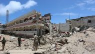 Security forces stand at the SYL hotel that was partly destroyed following a car bomb claimed by al Shabaab Islamist militants outside the president's palace in the Somali capital of Mogadishu. Photo: Reuters.