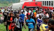 Fifty-three were killed and over 300 injured when a packed Cameroon passenger train derailed on October 21 while travelling between the capital Yaounde and the economic hub Douala, state broadcaster Crtv said. / AFP PHOTO / STRINGER