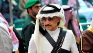 Prince Alwaleed bin Talal attends the traditional Saudi dance known as 'Arda', which was performed during Janadriya culture festival at Der'iya in Riyadh February 18, 2014. REUTERS/Fayez Nureldine/Pool/File Photo