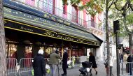 People walk in front of the Bataclan concert hall in Paris on November 11, 2016. AFP / MIGUEL MEDINA