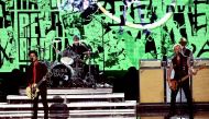 (L-R) Musicians Billie Joe Armstrong, Tre Cool and Mike Dirnt of Green Day perform onstage during the 2016 American Music Awards at Microsoft Theater on November 20, 2016 in Los Angeles, California. Kevin Winter/Getty Images/AFP