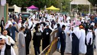 Kuwaiti men arrive to cast their votes for the parliamentary elections at a polling station in Kuwait City on November 26, 2016. Polls opened in Kuwait for the oil-rich Gulf state's seventh general election in a decade, at a time of sharp disputes over su