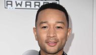 (FILES) This file photo taken on November 20, 2016 shows Recording artist John Legend arriving for the 2016 American Music Awards in Los Angeles, California. AFP / Valerie Macon