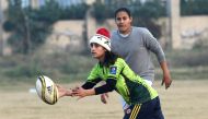 In this photograph taken on January 18, 2017, Pakistani rugby players take part in a practice session in Lahore. (AFP / ARIF ALI)