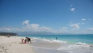 People relaxing at a Jamaican beach (Reuters)