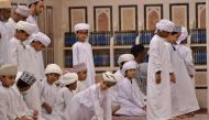 Children pray on October 31, 2017 at Muscat's Sayyida Mazoon mosque in the Gulf sultanate of Oman. AFP / GIUSEPPE CACACE