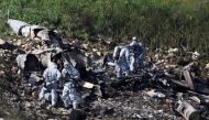 Israeli security forces examine the remains of an F-16 Israeli war plane near the village of Harduf, Israel February 10, 2018. REUTERS/ Ronen Zvulun
