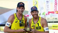 Robert Meeuwsen (left) and Alexander Brouwer celebrate their first World Tour gold of 2018, at Katara Beach yesterday. 