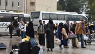 The fourth convoy carrying civilians depart from the Free Syrian Army (FSA) controlled area of Yarmouk Camp in southern Damascus under the Yarmouk camp evacuation agreement, as part of the compulsory evacuation as agreed on April 29, in Damascus, Syria on