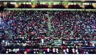 Football fans attend a match at the Khalifa International Stadium.