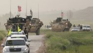 FILE PHOTO: Kurdish fighters from the People's Protection Units (YPG) head a convoy of U.S military vehicles in the town of Darbasiya next to the Turkish border, Syria April 28, 2017. REUTERS/Rodi Said