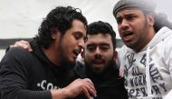 The late Syrian rebel fighter Abdel-Basset al-Sarout (L) singing during a rally to commemorate the beginning of the Syrian revoltion, in the town of Maaret al-Numan in the jihadist-held Idlib province. AFP / OMAR HAJ KADOUR