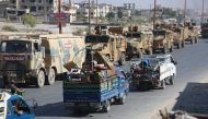 Turkish military convoy is seen on August 19, 2019 in Syria's northern province of Idlib. ?zzettin Idilbi - Anadolu 