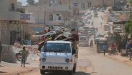 Syrians, with their belongings, are seen on their way from Syria’s de-escalation zones in Idlib, Syria on August 21, 2019. Hüseyin El Huleyf - Anadolu