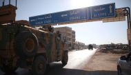 A Turkish army convoy drives along the Bab al-Hawa highway on August 24, 2019, on their way to reinforce a Turkish military observation point in northwestern Syria. AFP / Aaref WATAD