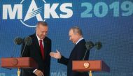 Russian President Vladimir Putin (R) and his Turkish counterpart Recep Tayyip Erdogan prepare to deliver a speech on stage during the MAKS-2019 International Aviation and Space Salon opening ceremony in Zhukovsky outside Moscow on August 27, 2019. / AFP /