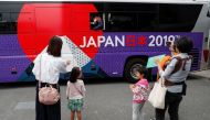 Ireland's rugby players wave from their bus after the Team Welcome Ceremony for Ireland team ahead of the start of the Rugby World Cup in Chiba, east of Tokyo, Japan September 13, 2019. REUTERS/Issei Kato