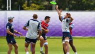 Italy's players play with a freesbee during a training session in a training ground in Fukuoka on September 24, 2019 during the Japan 2019 Rugby World Cup. / AFP / Gabriel BOUYS