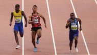 Christian Coleman of the US in action with Abdul Hakim Sani Brown of Japan and Mario Burke of Barbados. (Reuters Ahmed Jadallah) 