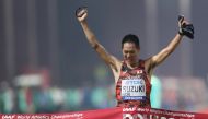 Japan’s Yusuke Suzuki crossing the finish line to win the men’s race walk gold. 