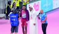 Abderrahman Samba with the Qatar Olympic Committee Chairman, H E Sheikh Joaan bin Hamad bin Khalifa Al Thani, after winning the hosts’ first medal at the IAAF Doha Worlds, yesterday. 
Pictures: Abdul basit / The Peninsula