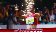 China’s Hong Liu crosses the finish line to win gold in the women’s 20 Kilometres race walk at the Corniche in Doha, yesterday.