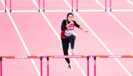 Qatar’s Mariam Farid in action during the women’s 400 metres hurdles heats yesterday. Picture: Abdul basit / The Peninsula