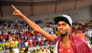 Qatar's Mutaz Essa Barshim celebrates winning gold REUTERS/Dylan Martinez