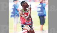 Kenya’s Conseslus Kipruto poses on the hurdle after winning the men’s 3000m steeplechase final on Friday.