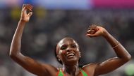 Kenya's Hellen Obiri celebrates winning the Women's 5000m final at the 2019 IAAF Athletics World Championships at the Khalifa International stadium in Doha on October 5, 2019. AFP / Jewel Samad 