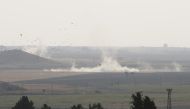 Smoke rises at the site as Turkish troops along with the Syrian National Army begin Operation Peace Spring in northern Syria against PKK/YPG, Daesh terrorists, in Sanliurfa, Turkey on October 09, 2019. ( E?ber Ayayd?n - Anadolu