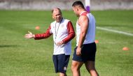 England's coach Eddie Jones (L) speaks with prop Ellis Genge (R) in a training session during the Japan 2019 Rugby World Cup, in Tokyo on October 9, 2019. / AFP / William West 