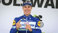 In this file photo taken on August 13, 2018 Dutch Fabio Jakobsen of Quick-Step Floors celebrates on the podium after winning the first stage of the Binkcbank Tour cycling race, 177.3 kilometres from Heerenveen to Bolsward. The Netherlands' Fabio Jakobsen 