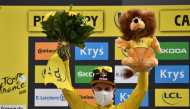 September 11, 2020. Team Jumbo-Visma rider Primoz Roglic of Slovenia, wearing the overall leader's yellow jersey, celebrates on the podium. Pool via REUTERS/Anne-Christine Poujoulat