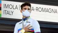 September 25, 2020 Italy's Filippo Ganna celebrates on the podium after winning the men's elite individual time trial REUTERS/Jennifer Lorenzini