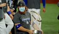 Los Angeles Dodgers third baseman Justin Turner (10) celebrates with the Commissioner's Trophy after the Los Angeles Dodgers beat the Tampa Bay Rays to win the World Series in game six of the 2020 World Series at Globe Life Field. Mandatory Credit: Kevin 