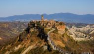 General view of Civita di Bagnoregio, accessible only by a bridge and known as 'the dying town', Italy, March 24, 2021.Reuters/Guglielmo Mangiapane