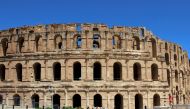 Two Bulgarian visitors stood in the ancient El Jem amphitheatre, one of Tunisia's top attractions, alone apart from swallows flitting under stone arches -- a sight foretelling another tourist season wrecked by Covid-19.