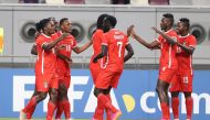 Sudan players celebrate their victory against Libya yesterday.  