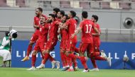 Bahrain players celebrate after scoring a goal yesterday. PIC: HUSSAIN SAYED 