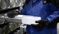 Lonnie Thompson, professor and research scientist at The Ohio State University, holds an ice core sample from a glacier in the Byrd Polar and Climate Research Center in Columbus, Ohio, U.S., January 15, 2021. The Byrd Polar and Climate Research Center gat