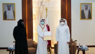 Dr. Hassan Al Derham (right) and Prof. Mariam Al Maadeed (left) presenting the winning students with medals and certificates.