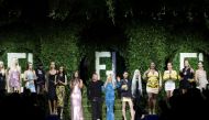 Fashion designer Kim Jones and Italian designer Donatella Versace appear with models at the end of Versace by Fendi and Fendi by Versace collection during Milan Fashion Week in Milan, Italy, September 26, 2021. Picture taken September 26, 2021. Versace an