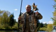 FILE PHOTO: Russian President Vladimir Putin fishes during a short vacation at an unknown location in Siberia, Russia, in this undated photo taken in September 2021 and released September 26, 2021. Sputnik/Alexei Druzhinin/Kremlin via REUTERS 